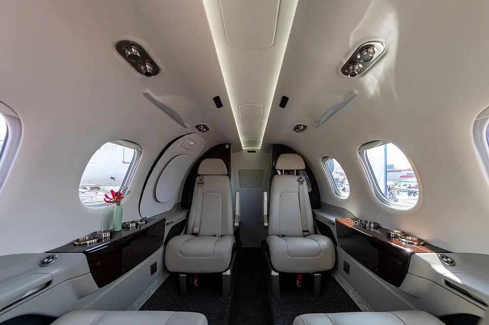 Phenom 100 EV cabin displayed at EBACE 2019.