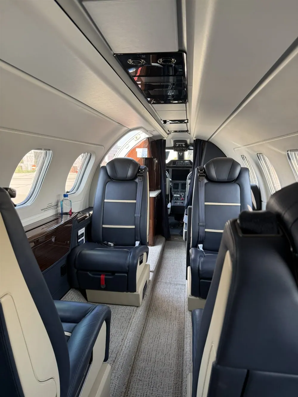 Representative light jet cabin with blue leather seating